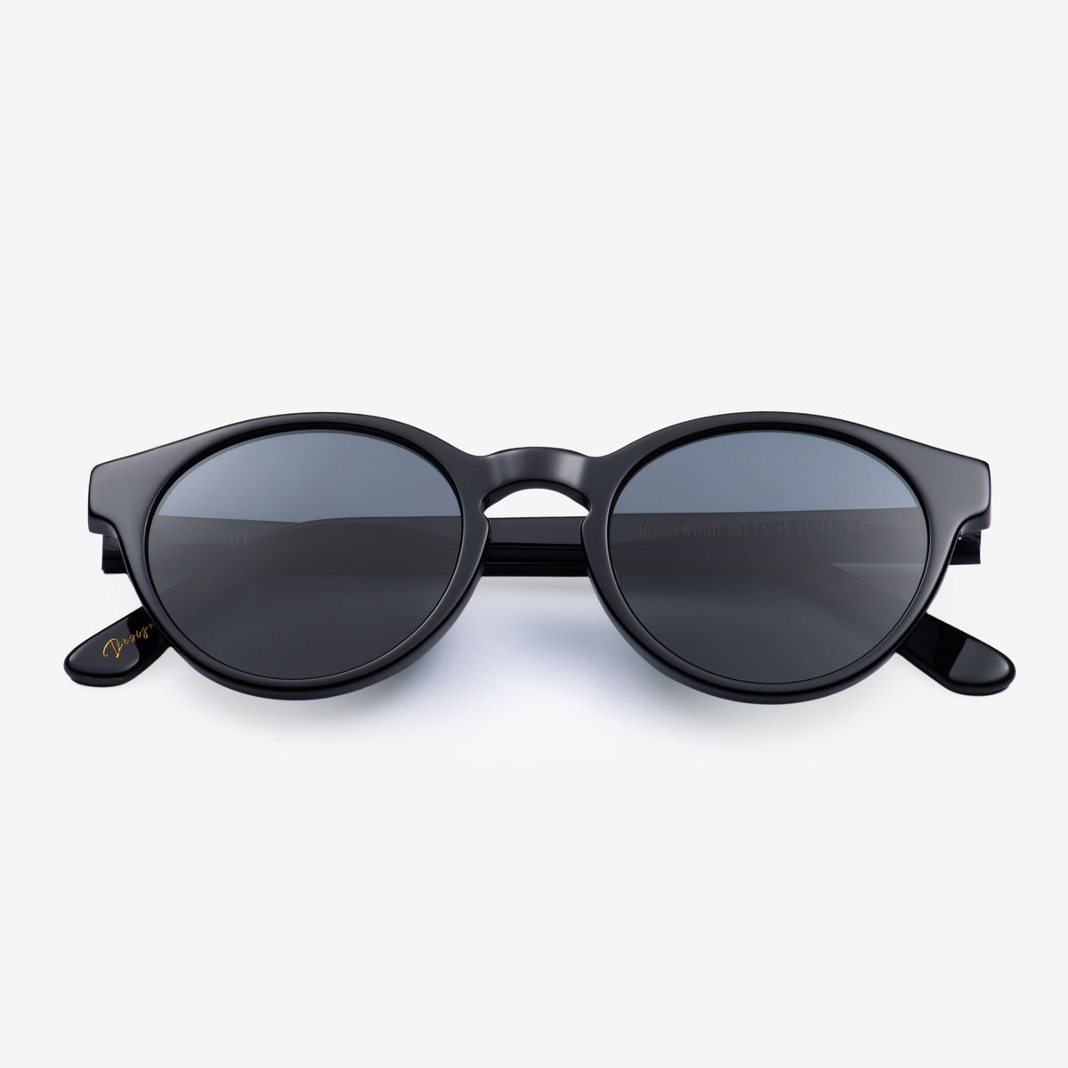 a pair of black scissors sitting on top of a white surface