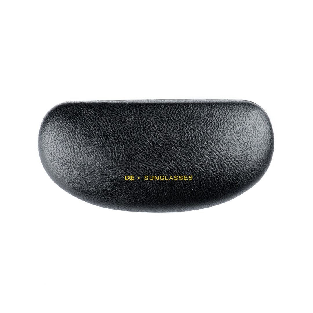 a close up of a black hat on a bench