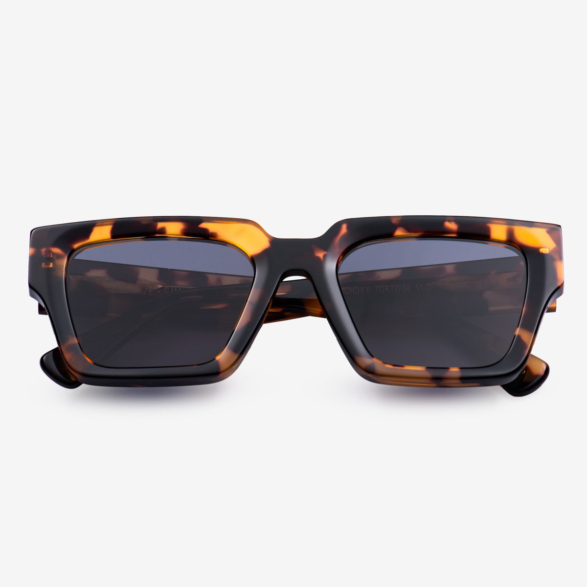 a pair of black scissors sitting on top of a table