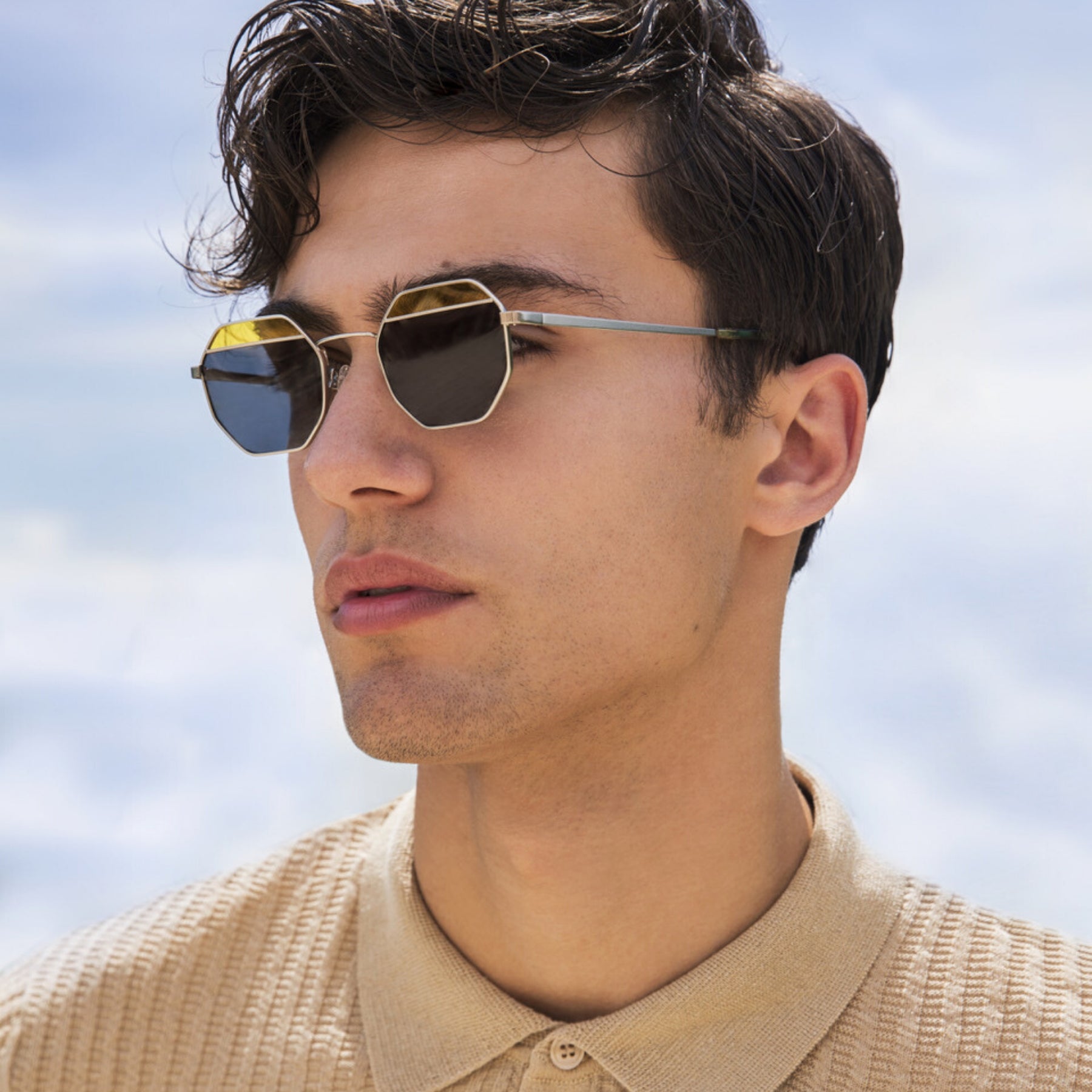 a close up of a person wearing sunglasses 